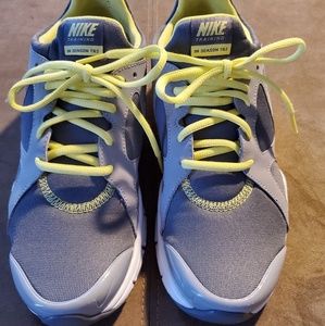 Nike women's gray and yellow athletic shoes